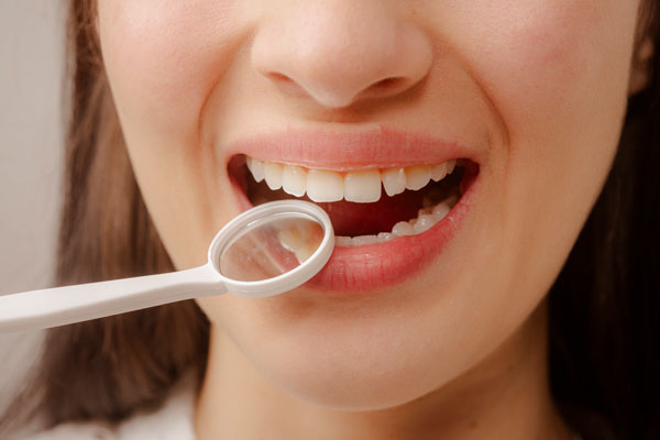 How A Restorative Dentist Helps Rebuild Your Smile